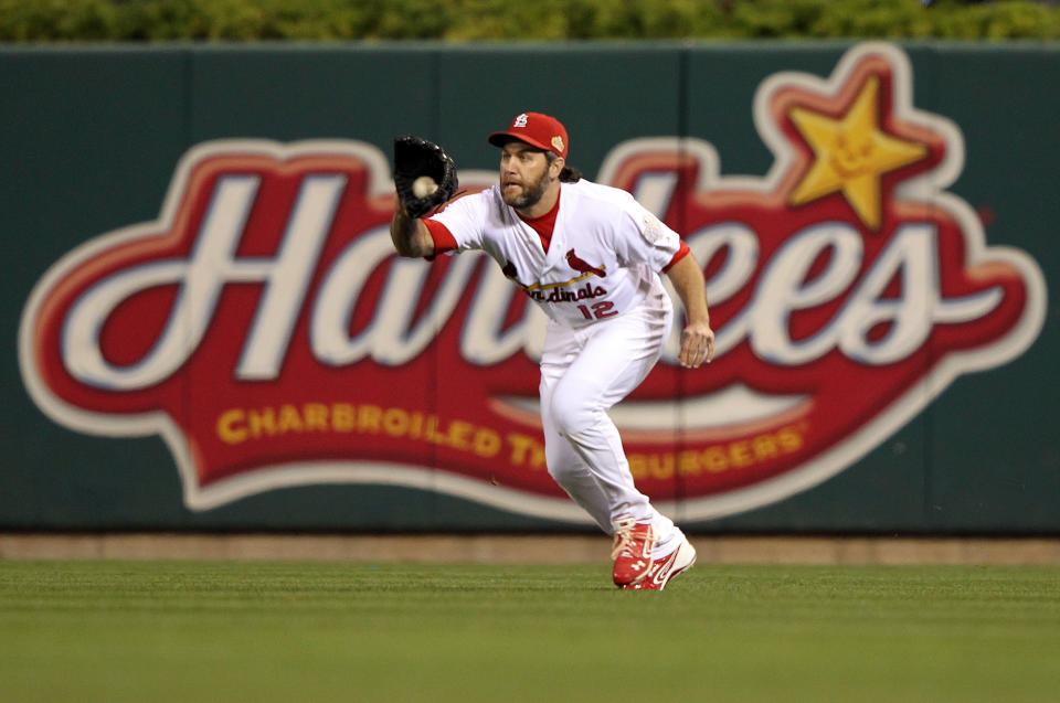 ST LOUIS, MO - OCTOBER 28: Lance Berkman #12 of the St. Louis Cardinals makes a catch during Game Seven of the MLB World Series against the Texas Rangers at Busch Stadium on October 28, 2011 in St Louis, Missouri. (Photo by Jamie Squire/Getty Images)