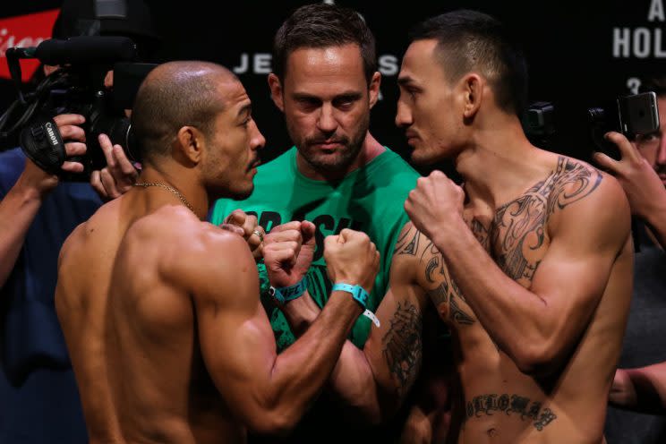 Jose Aldo (L) and Max Holloway face off after the weigh-in for their UFC 212 fight. (Getty)