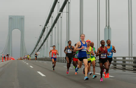 The elite men runners make their way across the Verrazano-Narrows Bridge during the start of the New York City Marathon in New York, U.S., November 5, 2017. REUTERS/Lucas Jackson