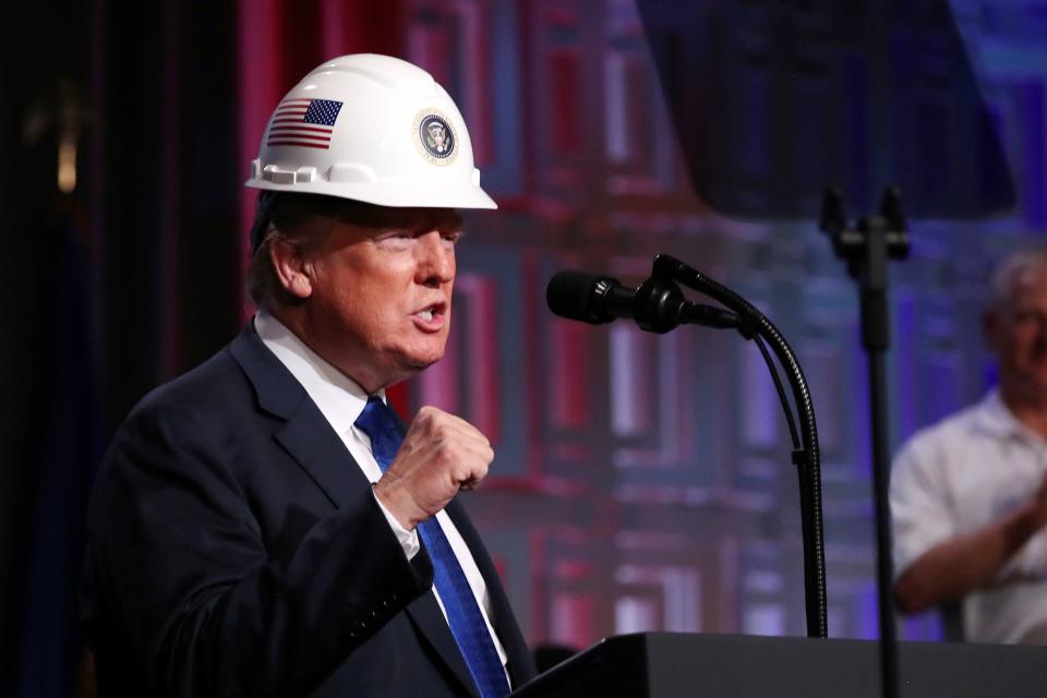 President Donald Trump addresses a crowd of electrical contractors. Trump's celebration of blue-collar workers was a key part of his appeal in 2016, but he hasn't governed accordingly. (Jonathan Ernst / Reuters)