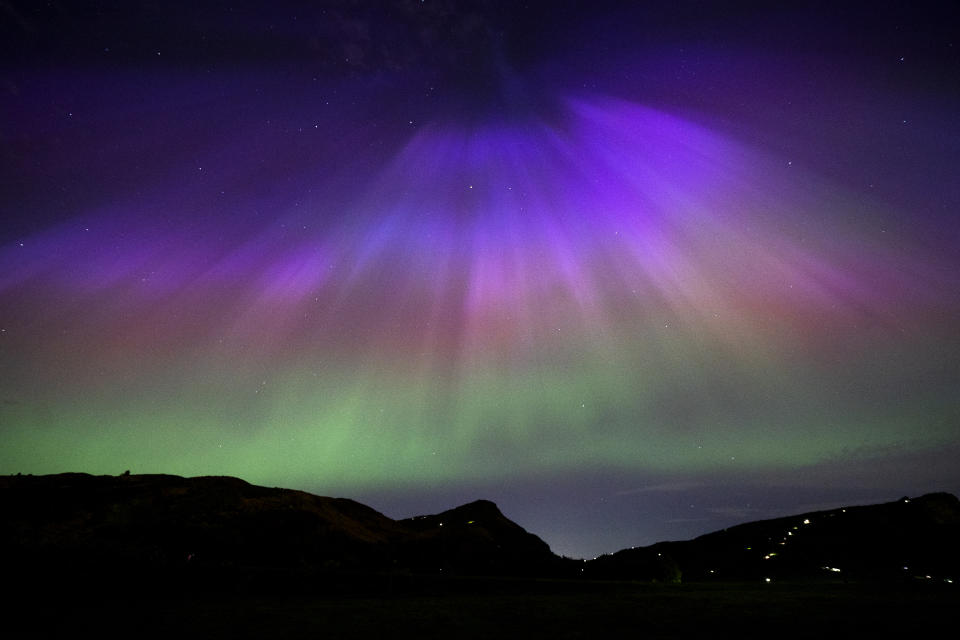 The aurora borealis, also known as the northern lights, above Arthur's Seat and Salisbury Crags in Holyrood Park, Edinburgh. Picture date: Friday May 10, 2024. (Photo by Jane Barlow/PA Images via Getty Images)