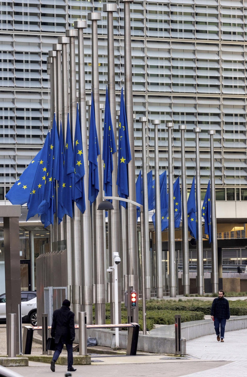 European Union flags flap in the wind at half-staff, in honour of European Parliament President David Sassoli, at EU headquarters in Brussels, Tuesday, Jan. 11, 2022. David Sassoli, the Italian journalist who worked his way up in politics and became president of the European Union's parliament, died at a hospital in Italy early Tuesday, Jan. 11, 2022 his spokesperson said. (AP Photo/Olivier Matthys)