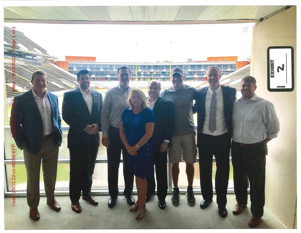 Former NFL football player Brett Favre, welfare officials and University of Southern Mississippi staffers met in July of 2017 to discuss the welfare agency funding the construction of a multi-million dollar volleyball stadium on campus. From left to right, attendees of the gathering were former professional wrestler Ted “Teddy” DiBiase, MDHS deputy Garrig Sheilds, then-USM Director of Athletics Jon Gilbert, Mississippi Community Education Center founder Nancy New, then-MDHS Director John Davis, Favre, another university athletics staffer Daniel Feig and Zach New.