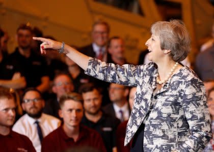 Britain's Prime Minister Theresa May answers questions during a Q&A session with employees at the Armstrong Works engineering facility, which is part of the Recce Group, in Newcastle upon Tyne, Britain, July 23, 2018. REUTERS/Russell Cheyne