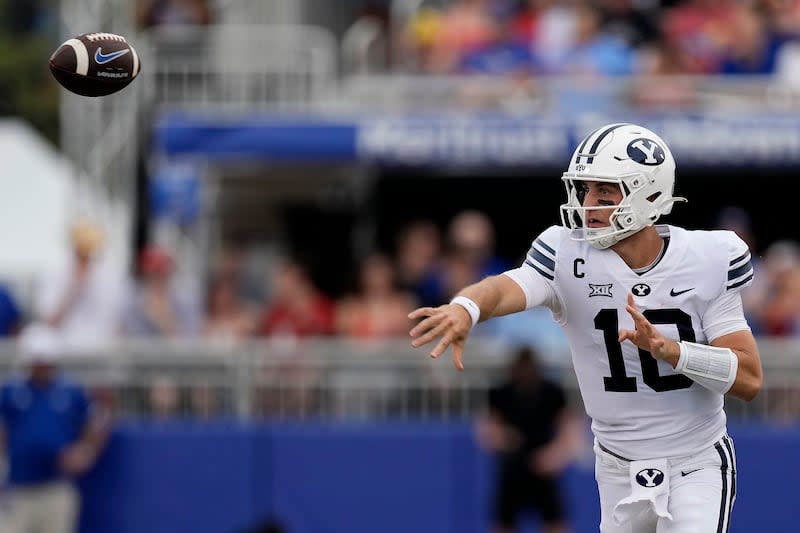 BYU quarterback Kedon Slovis passes the ball during the first half of a game against Kansas Saturday, Sept. 23, 2023, in Lawrence, Kan. | Charlie Riedel, Associated Press