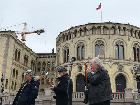 Street musicians play in the front of the Parliament in Oslo, Norway March 20, 2017. REUTERS/Nerijus Adomaitis