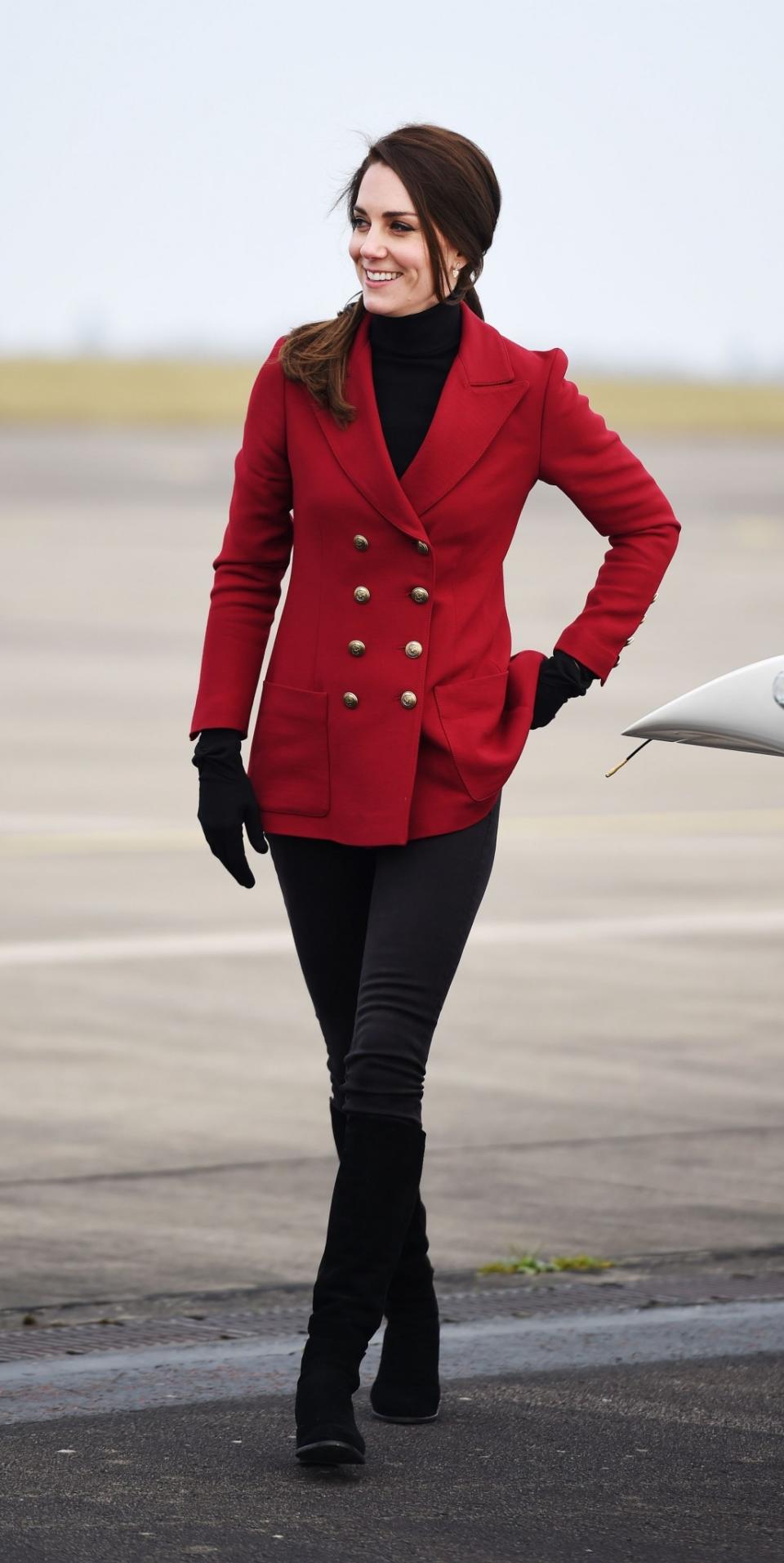 <p>The Duchess spent Valentine’s Day with young Air Cadets at an RAF base near Peterborough. She suitably wore a military-inspired look featuring a double-breasted red jacket by Philosophy di Lorenzo Serafini and her favourite suede Stuart Weitzman boots.<br><i>[Photo: PA]</i> </p>