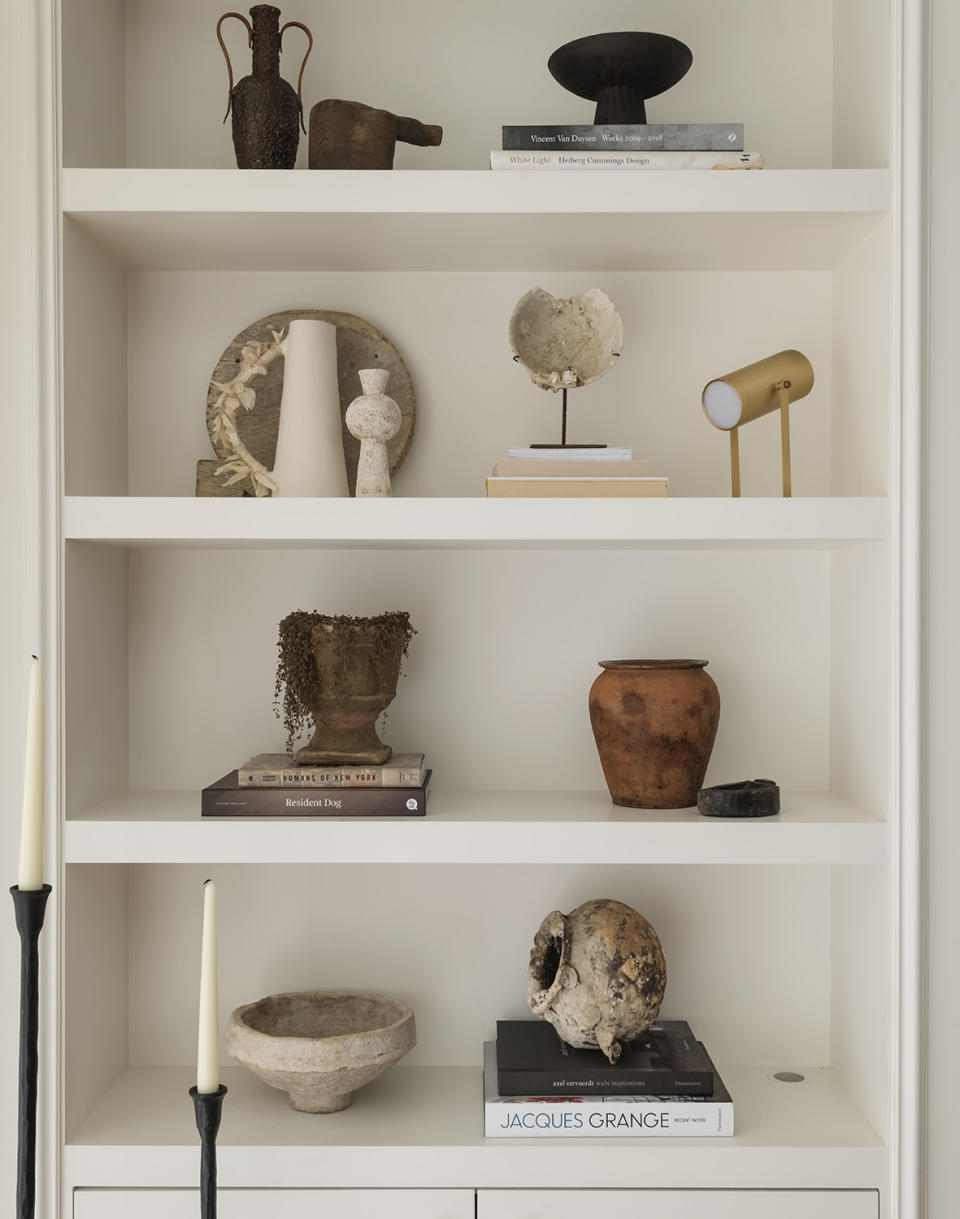 living room shelving filled with objets