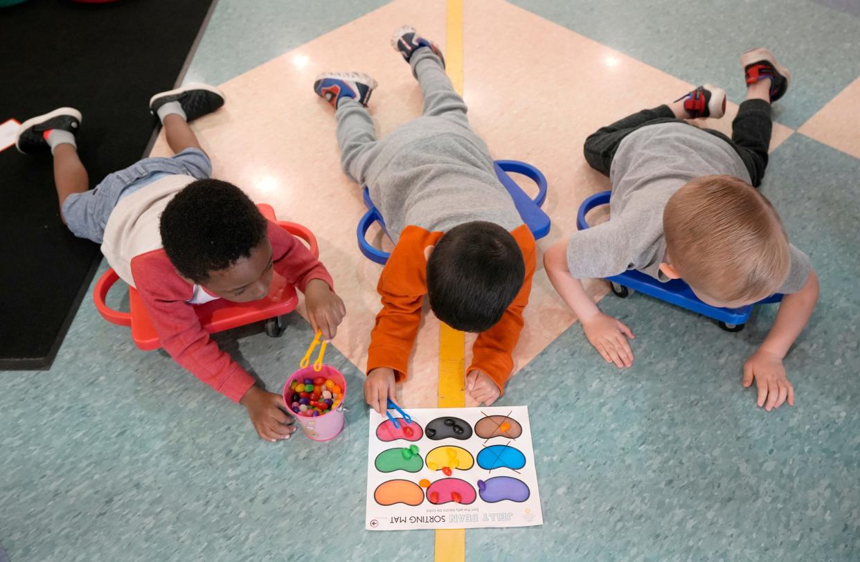 April 22, 2022; Hilliard, Ohio, USA; Students work on an occupational therapy activity in a hallway at Hilliard City Schools Preschool on Friday. An expansion to the school will add eight classrooms and much-needed space for 60 more students. Mandatory Credit: Barbara Perenic/Columbus Dispatch