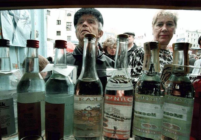 People purchasing vodka from a street kiosk in Moscow. A 2011 WHO report found that every fifth male death in Russia was attributable to the effects of alcohol, with the average male drinker knocking back 35.40 litres of pure alcohol per year