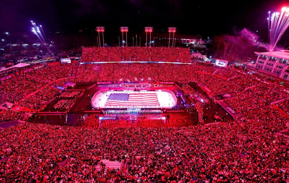 Fireworks go off during the national anthem before the NHL Stadium Series game between the Carolina Hurricanes and the Washington Capitals at Carter-Finley Stadium in Raleigh, N.C., Saturday, Feb. 18, 2023.