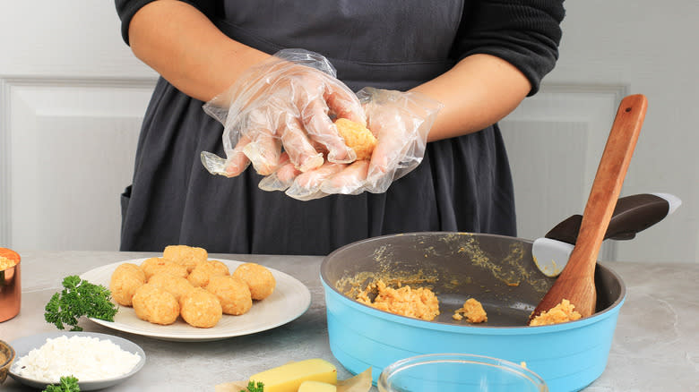 Person making arancini