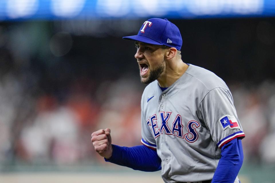 Texas Rangers relief pitcher Nathan Eovaldi reacts after getting out of a basses loaded jam during the fifth inning of Game 2 of the baseball AL Championship Series against the Houston Astros Monday, Oct. 16, 2023, in Houston. (AP Photo/Godofredo A. Vasquez)