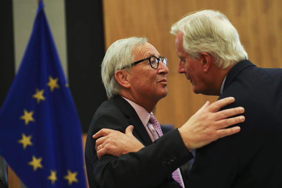 European Commission President Jean-Claude Juncker, left, greets European Union chief Brexit negotiator Michel Barnier during a weekly meeting of the College of Commissioners at EU headquarters in Brussels, Wednesday, Oct. 2, 2019. British Prime Minister Boris Johnson was due to send to Brussels what he says is the U.K.'s "final offer" for a Brexit deal, with the date set for Britain's departure less than a month away. (AP Photo/Francisco Seco)