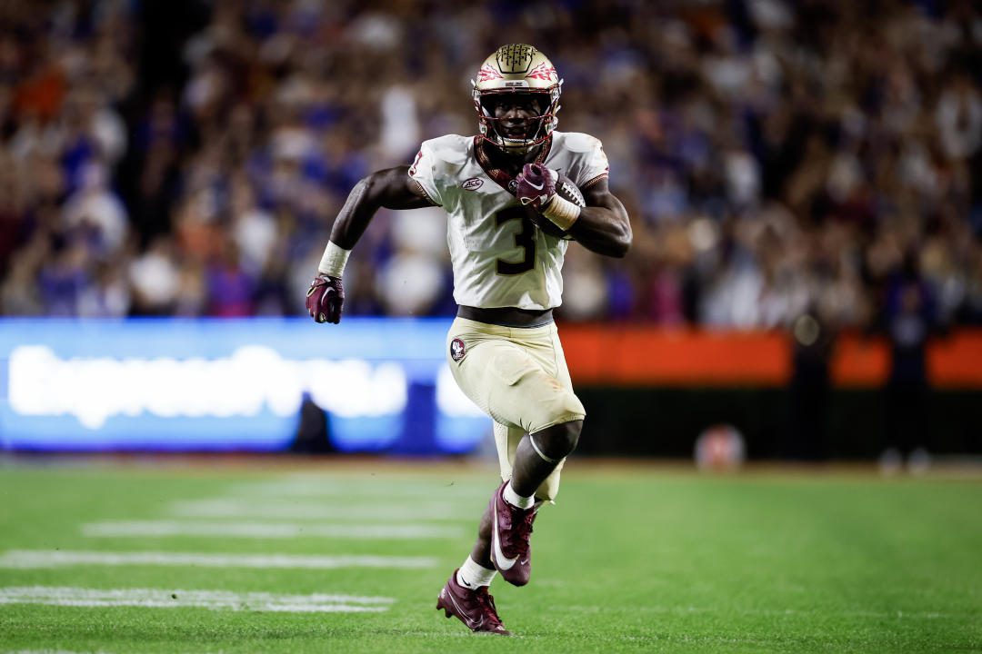 GAINESVILLE, FLORIDA - NOVEMBER 25: Trey Benson #3 of the Florida State Seminoles scores a touchdown during the second half of a game against the Florida Gators at Ben Hill Griffin Stadium on November 25, 2023 in Gainesville, Florida. (Photo by James Gilbert/Getty Images)