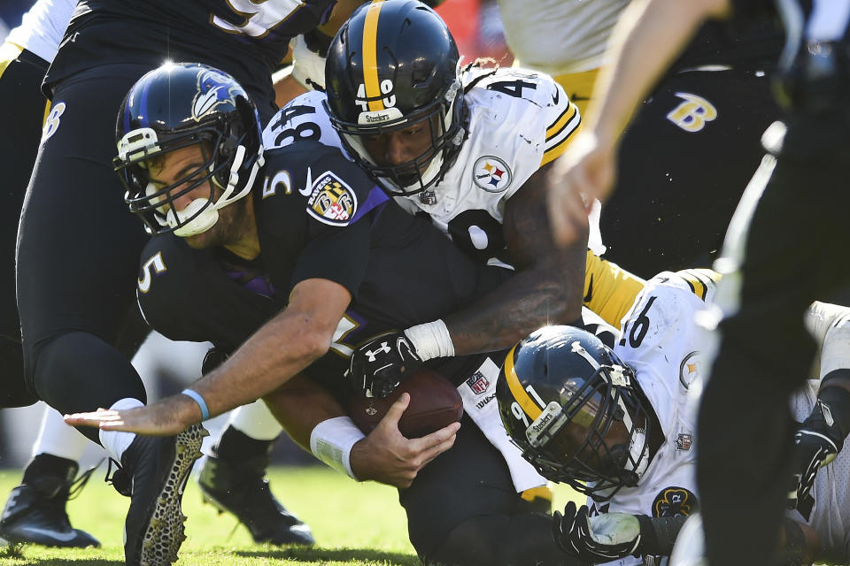 <p>Baltimore Ravens quarterback Joe Flacco (5) is sacked by Pittsburgh Steelers outside linebacker Bud Dupree (48) during the second half of an NFL football game in Baltimore, Sunday, Oct. 1, 2017. The Steelers defeated the Ravens 26-9. (AP Photo/Gail Burton) </p>