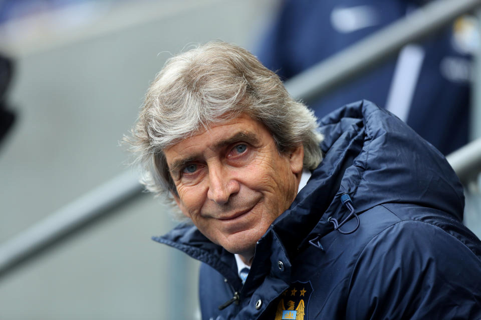 Manchester City's manager Manuel Pellegrini takes his seat before the English Premier League soccer match between Manchester City and West Ham United at the Etihad Stadium in Manchester, England, Sunday May 11, 2014. (AP Photo/Jon Super)