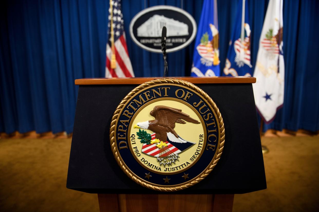 A lecturn at the U.S. Department of Justice BRENDAN SMIALOWSKI/AFP via Getty Images