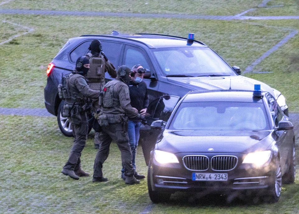 The defendant Thomas Drach, right, arrives by helicopter at the Cologne Justice Center in Cologne, Germany, Thursday, Jan. 4, 2024. The German man who served prison time for a high-profile 1996 kidnapping was convicted of robbery and attempted murder on Thursday for his alleged role in a string of armed robberies in Germany in 2018 and 2019. The Cologne state court on Thursday sentenced Thomas Drach to 15 years in prison. (Thomas Banneyer/dpa via AP)