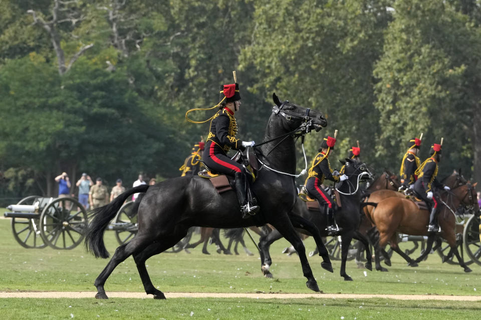 The King's Troop Royal Horse Artillery leave after firing a 41 Gun Royal Salute supported by the Band of the Grenadier Guards, on the first anniversary of the death of Queen Elizabeth II, in Hyde Park in London, Friday, Sept. 8, 2023. With gun salutes and tolling bells, Britain is marking the first anniversary of the death of Queen Elizabeth II and the ascension of King Charles III, who remembered his mother as a symbol of stability during her 70-year reign. (AP Photo/Kirsty Wigglesworth)