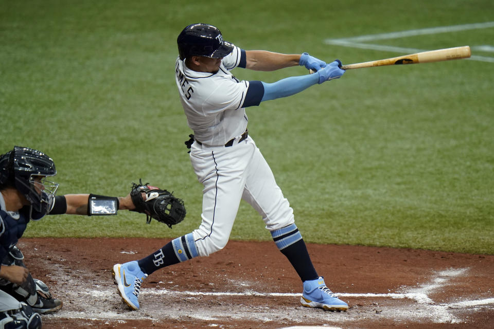 Tampa Bay Rays' Willy Adames lines an RBI double off New York Yankees starting pitcher Corey Kluber during the second inning of a baseball game Friday, April 9, 2021, in St. Petersburg, Fla. Rays' Yandy Diaz scored on the hit. (AP Photo/Chris O'Meara)