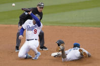 Miami Marlins' Jazz Chisholm Jr., right, steals second base as Los Angeles Dodgers shortstop Gavin Lux (9) loses control of the ball during the seventh inning of a baseball game Sunday, May 16, 2021, in Los Angeles. (AP Photo/Ashley Landis)