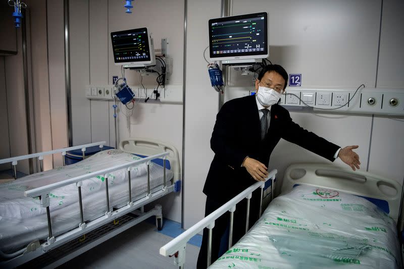 Doctor Hangzhou Lu, co-director of Shanghai Public Clinical Center Shanghai, shows a quarantine room for coronavirus patients at finished but still unused building A2, in Shanghai