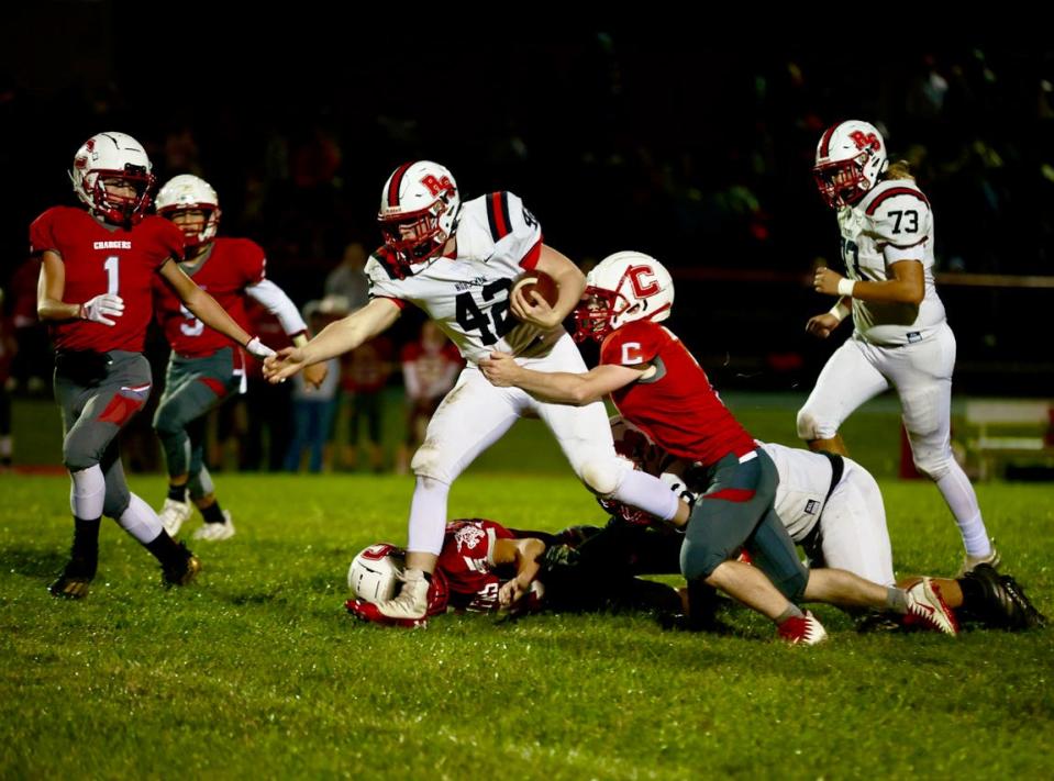 Nick Butler fights for yardage on a run during Roland-Story's 24-14 victory at Chariton Friday.