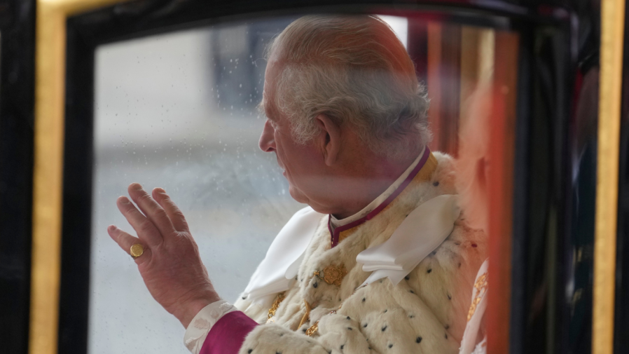 <em><sub>Britain’s King Charles III waves to the gathering as he travels in the Diamond Jubilee State Coach towards Westminster Abbey to his coronation ceremony, in London, Saturday, May 6, 2023. (AP Photo/Mosa’ab Elshamy)</sub></em>