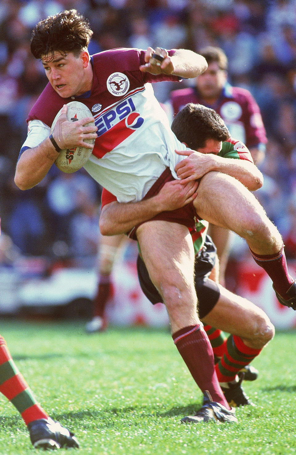 Mark Carroll (pictured)  of the Sea Eagles is tackled during an NRL match.