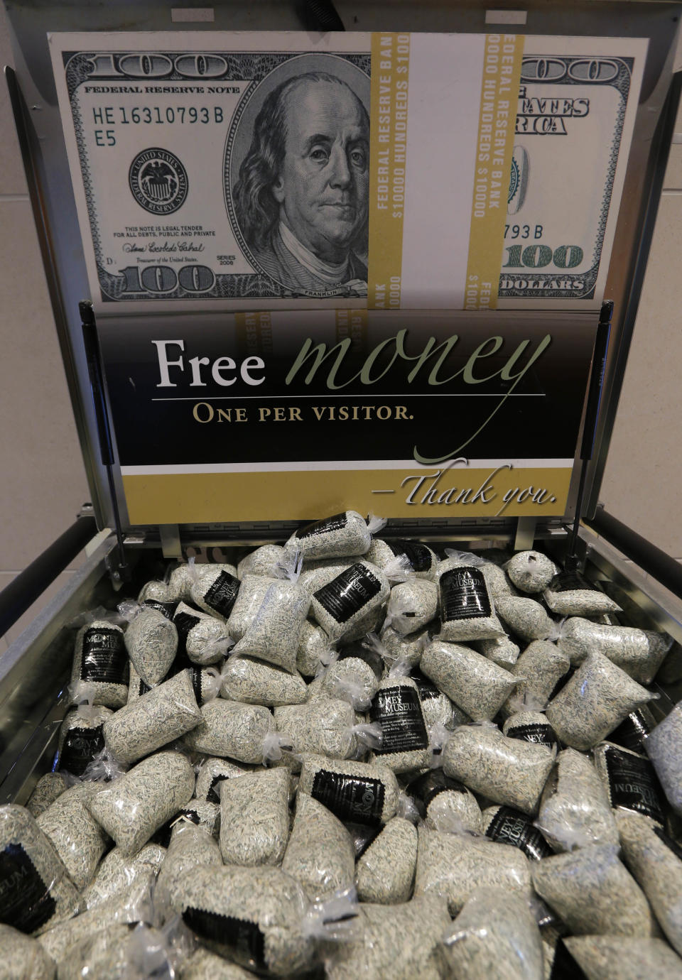 This Feb. 11, 2014 photo shows free bags of money, shredded currency that was unfit for circulation, available following tours of The Money Museum at the Federal Reserve Bank of Kansas City in Kansas City, Mo. The Money Museum at the Federal Reserve Bank of Kansas City is a one-stop shop for many things dollar. The museum takes visitors through the history of modern currency and the Fed system. (AP Photo/Orlin Wagner)