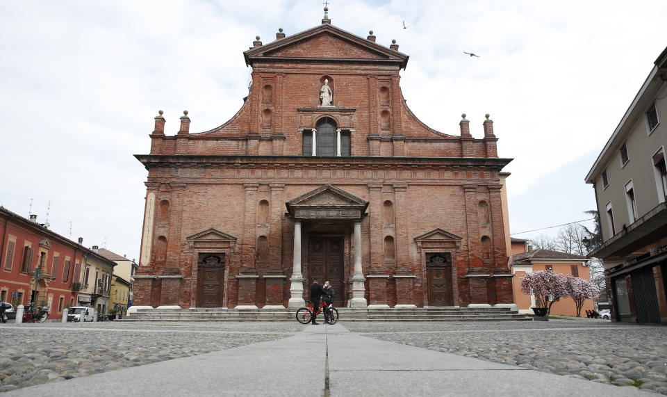 FILE - In this file photo taken on Thursday, March 12, 2020, a view of the almost empty main square in Codogno, Italy where the first case of COVID-19 was registered. Pope Francis and Italy's president have marked the nation's first annual day to honor doctors, nurses and other health care workers, exactly a year after the nation's first known native case of COVID-19 emerged. In a message to honor those caring for COVID-19 patients, Frances hailed the “generous involvement, at times heroic, of the profession lived as mission.” (AP Photo/Antonio Calanni, File)