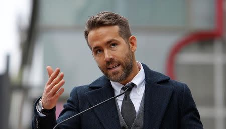 Actor Ryan Reynolds speaks before the unveiling of his star on the Hollywood Walk of Fame in Hollywood, California U.S., December 15, 2016. REUTERS/Mario Anzuoni