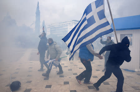 Protesters clash with police officers during a demonstration against the agreement reached by Greece and Macedonia to resolve a dispute over the former Yugoslav republic's name, in Athens, Greece, January 20, 2019. REUTERS/Alexandros Avramidis