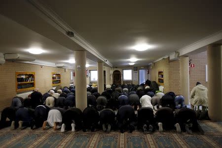 Members of the Muslim community attend the Friday prayer at Attadamoun Mosque in the neighbourhood of Molenbeek, in Brussels, Belgium, November 20, 2015. REUTERS/Youssef Boudlal