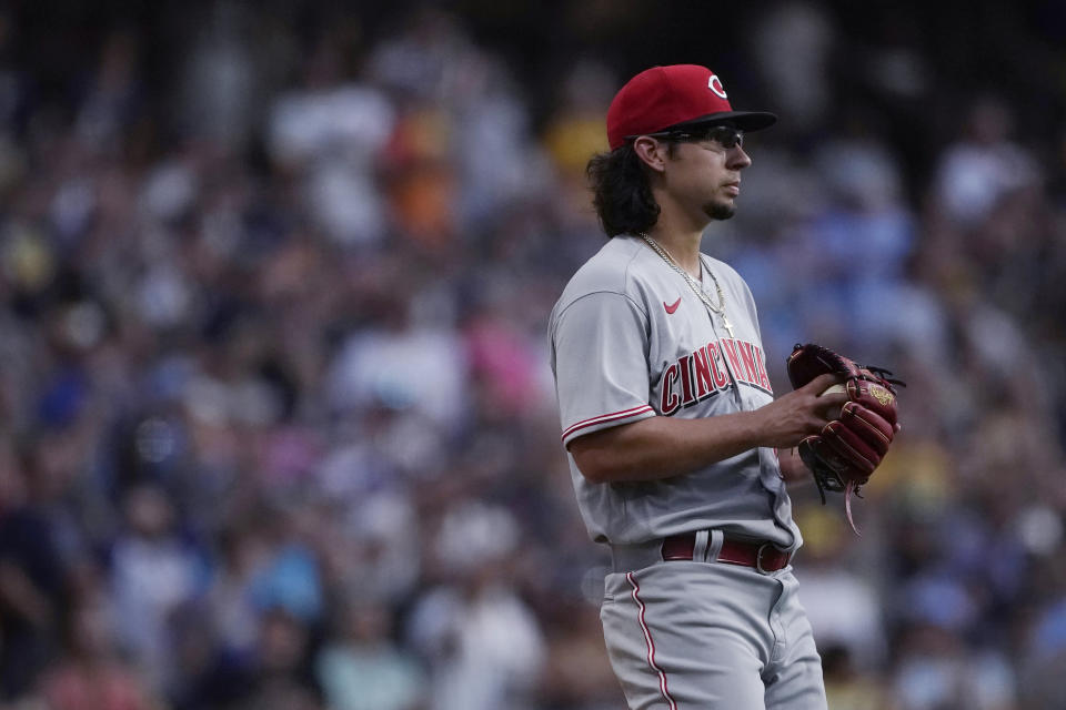 Cincinnati Reds' Robert Dugger reacts after giving up a two-run home run to Milwaukee Brewers' Rowdy Tellez during the first inning of a baseball game Friday, Aug. 5, 2022, in Milwaukee. (AP Photo/Aaron Gash)