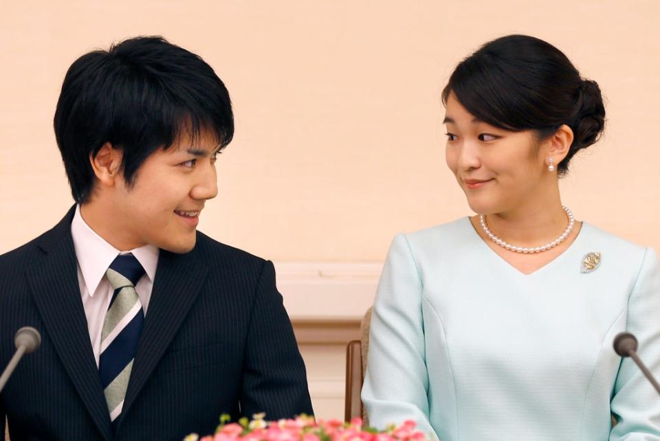 Princess Mako and her fiance Kei Komuro smile during a press conference to announce their engagement at the Akasaka East Residence in Tokyo in 2017 (AFP via Getty Images)