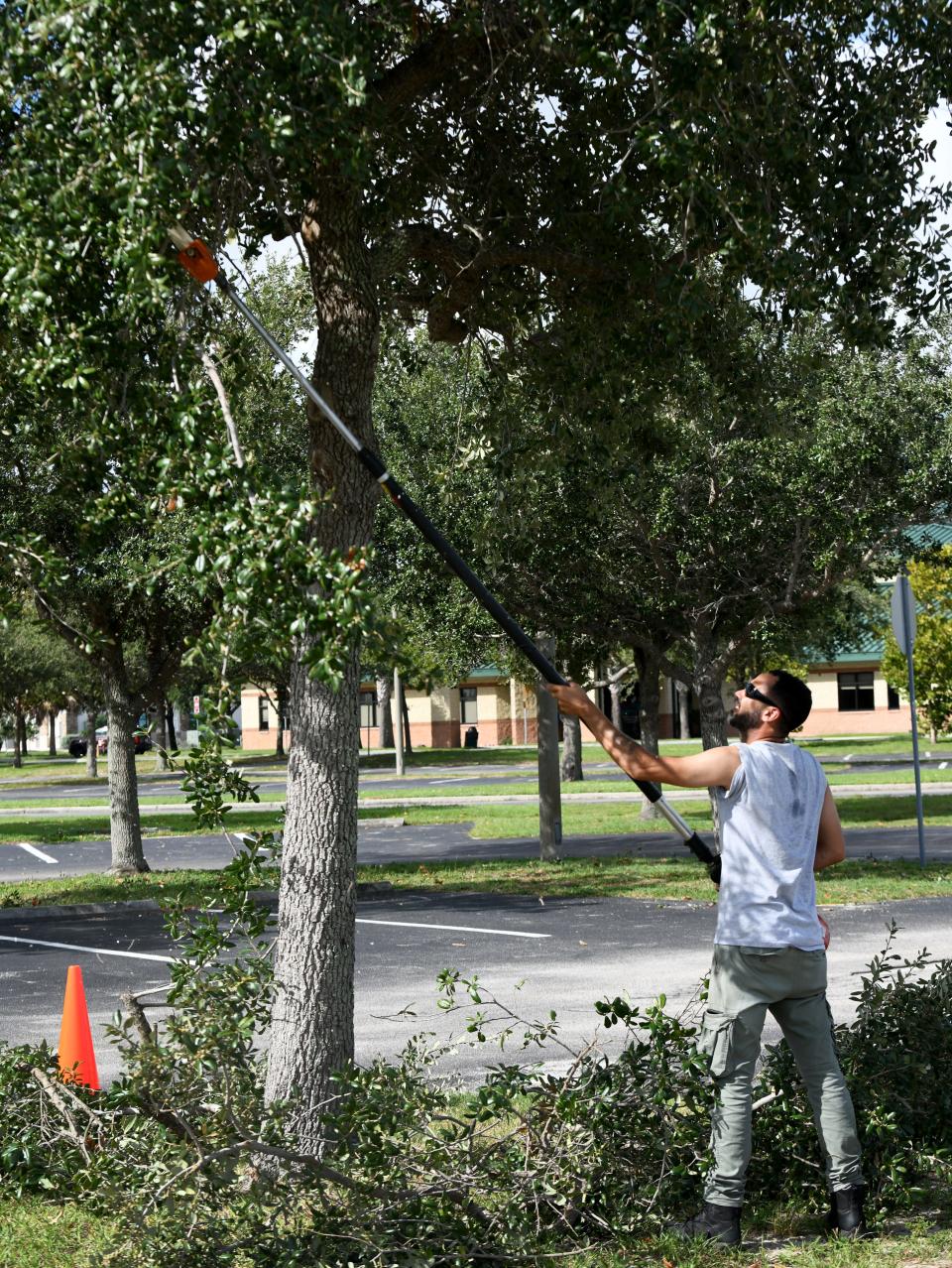 Todd Sharpe, a Brevard County Parks and Recreation Department maintenance technician 2, trims trees at Viera Regional Park. He has been working with the county for eight years. Parks maintenance worker positions are among ones that are difficult to fill for the county.