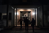 Attendees tour a mansion purchased by the Black Lives Matter Global Network Foundation before a welcome dinner for the annual Families United 4 Justice Network Conference, hosted by the foundation in the Studio City neighborhood of Los Angeles, Thursday, Sept. 28, 2023. The national Black Lives Matter nonprofit that was widely criticized for purchasing a sprawling California mansion with donated funds recently opened the property to dozens of families who lost loved ones in incidents of police violence. (AP Photo/Jae C. Hong)