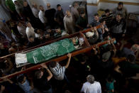 <p>Palestinians carry the body of Mousab Abu Leila, 29, during his funeral after he was killed during a protest on the border with Israel, in Gaza City, Monday, May 14, 2018. (Photo: Dusan Vranic/AP) </p>