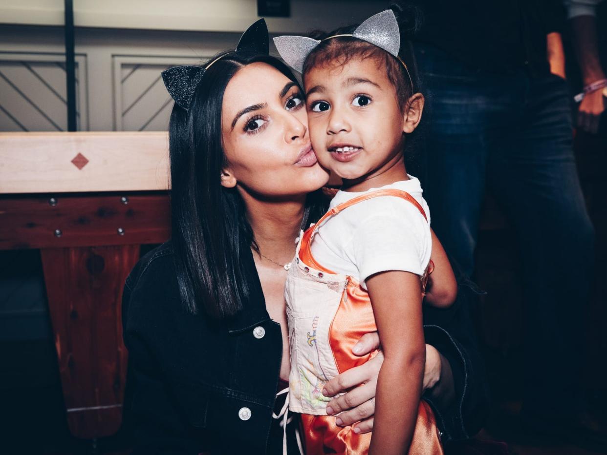 Kim Kardashian and North West attend Ariana Grande's "Dangerous Woman" tour.