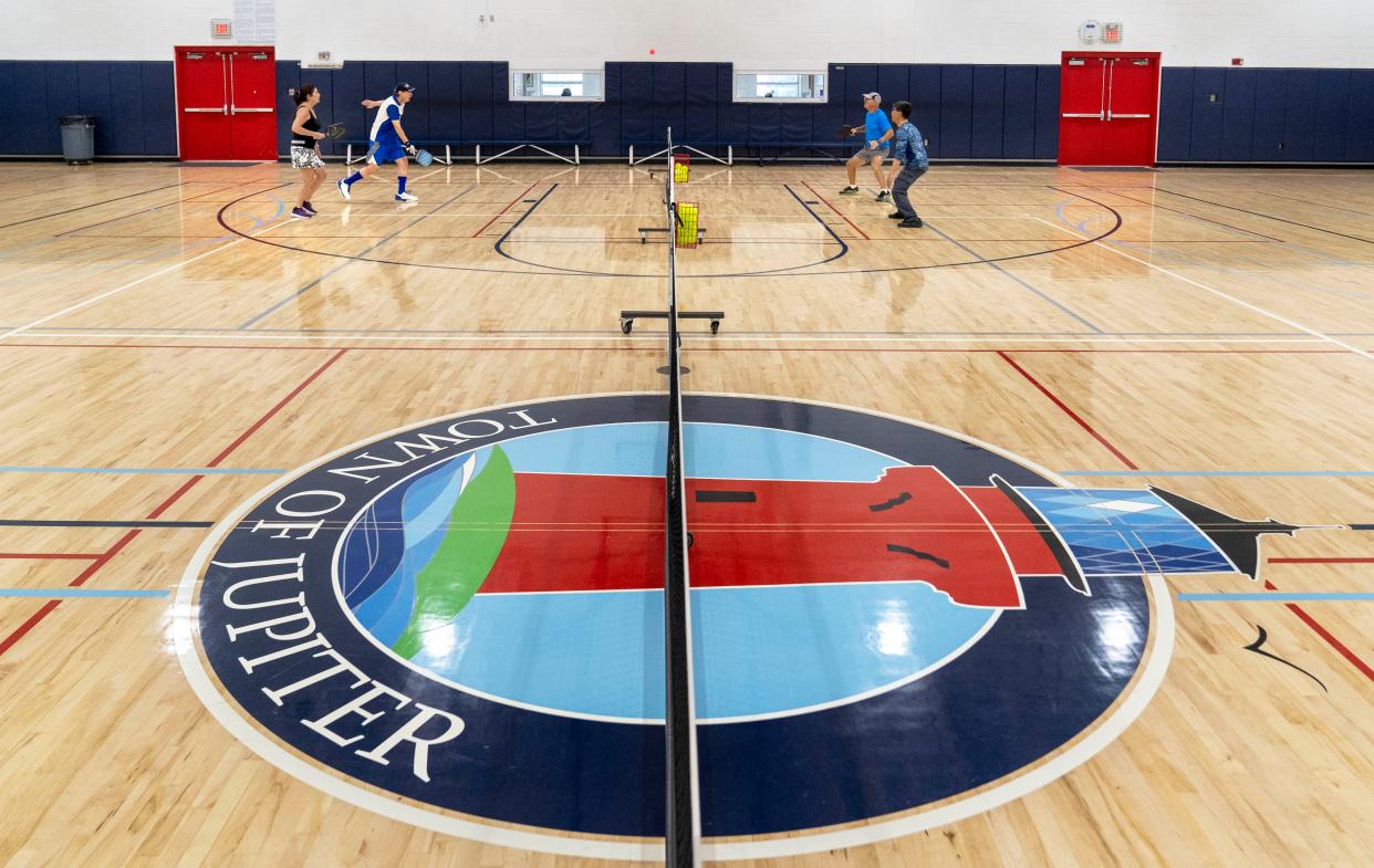 Jupiter Community Center gym does double time as space for six mobile indoor courts.