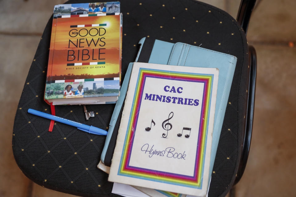 A hymn book and Bible are seen during a church service at the Cosmopolitan Affirming Community church, which serves a predominantly LGBTQ congregation, in Nairobi, Kenya, on Sunday, Oct. 17, 2021. “The mainstream churches – all of them – they actually are totally against it,” says Caroline Omolo, associate pastor at the church. It is a rare example of a church in Africa serving a predominantly LGBTQ congregation. (AP Photo/Brian Inganga)