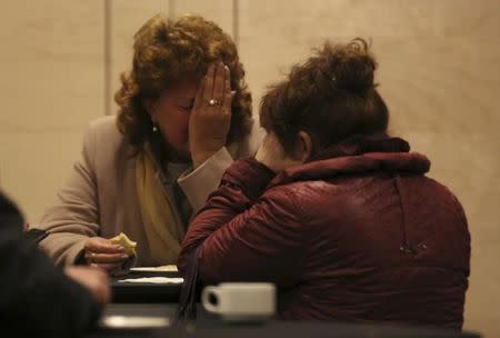 Relatives of victims of a Russian airliner which crashed in Egypt, mourn at a hotel near Pulkovo airport in St. Petersburg, Russia, October 31, 2015. REUTERS/Peter Kovalev