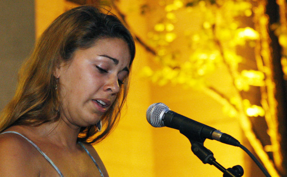 Boston University student Tori Pinheiro of New Beford, Mass., and Austin Brashears' girlfriend speaks during a candlelight vigil on Marsh Plaza at Boston University, Saturday, May 12, 2012, in Boston, for three students studying in New Zealand who were killed when their minivan crashed during a weekend trip. At least five other student were injured in the accident, including one who was in critical condition. Boston University spokesman Colin Riley said those killed in the accident were Daniela Lekhno, 20, of Manalapan, N.J.; Brashears, 21, of Huntington Beach, Calif.; and Roch Jauberty, 21, whose parents live in Paris. (AP Photo/Bizuayehu Tesfaye)