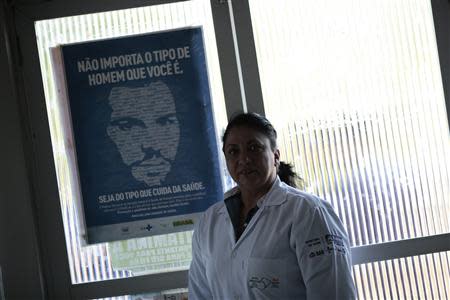 Cuban doctor Dania Rosa Alvero Pez poses for a photo inside the health center where she works in the city of Jiquitaia in the state of Bahia, north-eastern Brazil, November 18, 2013. REUTERS/Ueslei Marcelino