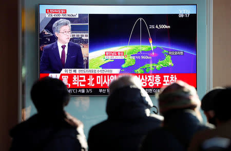 People watch a television broadcast of a news report on North Korea firing what appeared to be an intercontinental ballistic missile (ICBM) that landed close to Japan, in Seoul, South Korea, November 29, 2017. REUTERS/Kim Hong-Ji