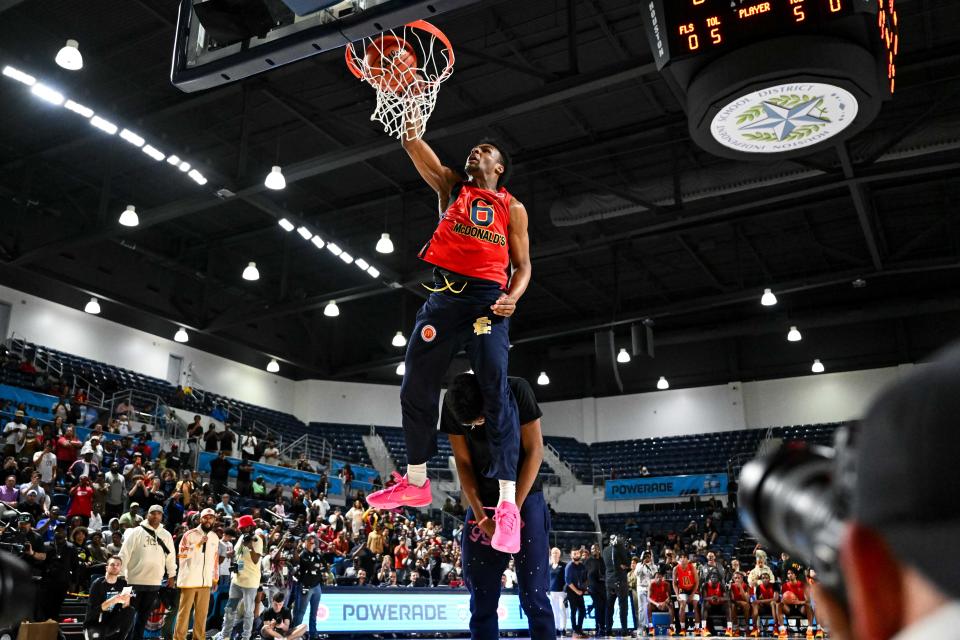 Mar 27, 2023; Houston, TX, USA; McDonald’s All American West guard Bronny James (6) dunks the ball over his brother Bryce Maximus James during the Powerade Jam Fest at Delmar Athletic Complex. Mandatory Credit: Maria Lysaker-USA TODAY Sports