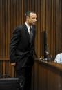 Olympic and Paralympic track star Oscar Pistorius stands in the dock during court proceedings at the North Gauteng High Court in Pretoria March 18, 2014. Pistorius is on trial for murdering his girlfriend Reeva Steenkamp at his suburban Pretoria home on Valentine's Day last year. REUTERS/Werner Beukes/Pool (SOUTH AFRICA - Tags: SPORT CRIME LAW ATHLETICS)