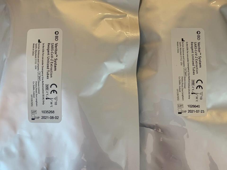 The COVID-19 rapid test kits that Sarah Wilkie received in Regina show an expired date on them. (Sarah Wilkie - image credit)